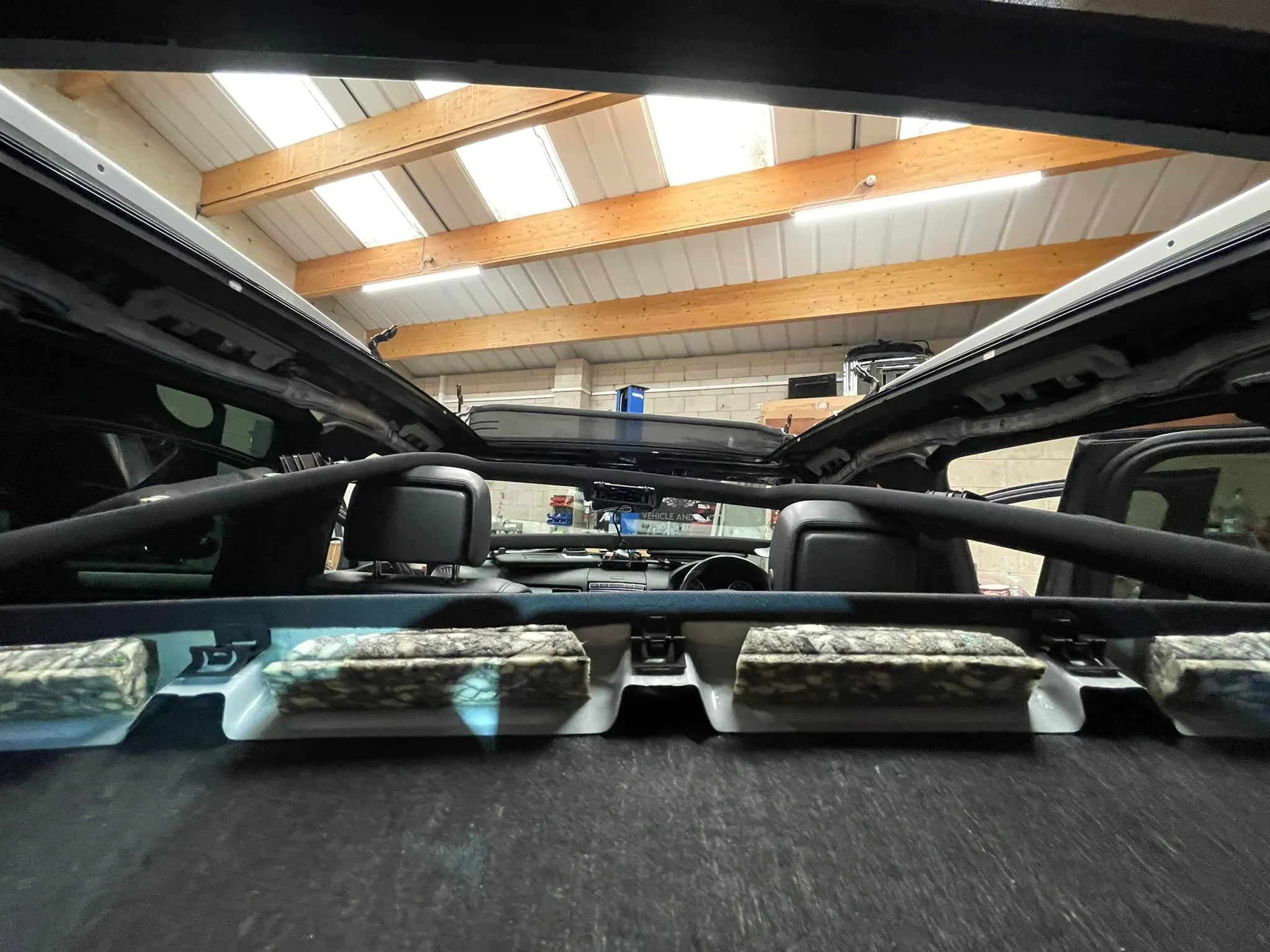 A view of the back of a vehicle from inside the vehicle.