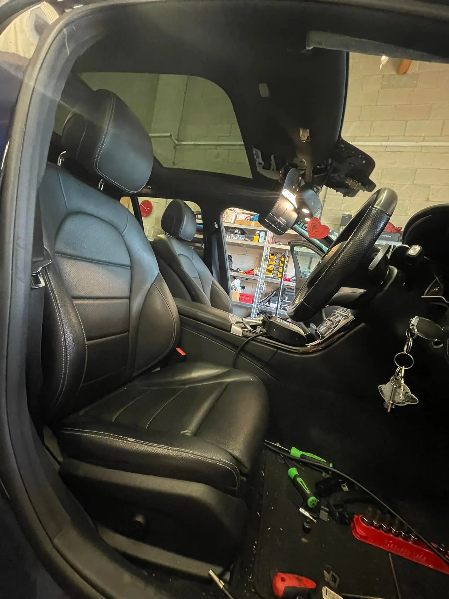 The inside of a car with the seat up.