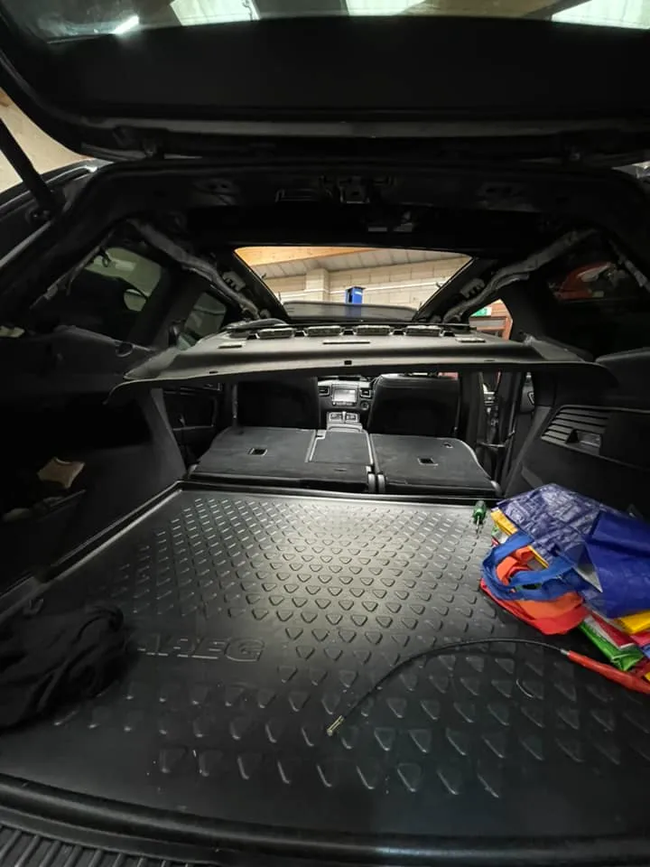 The back of a car with the trunk open.