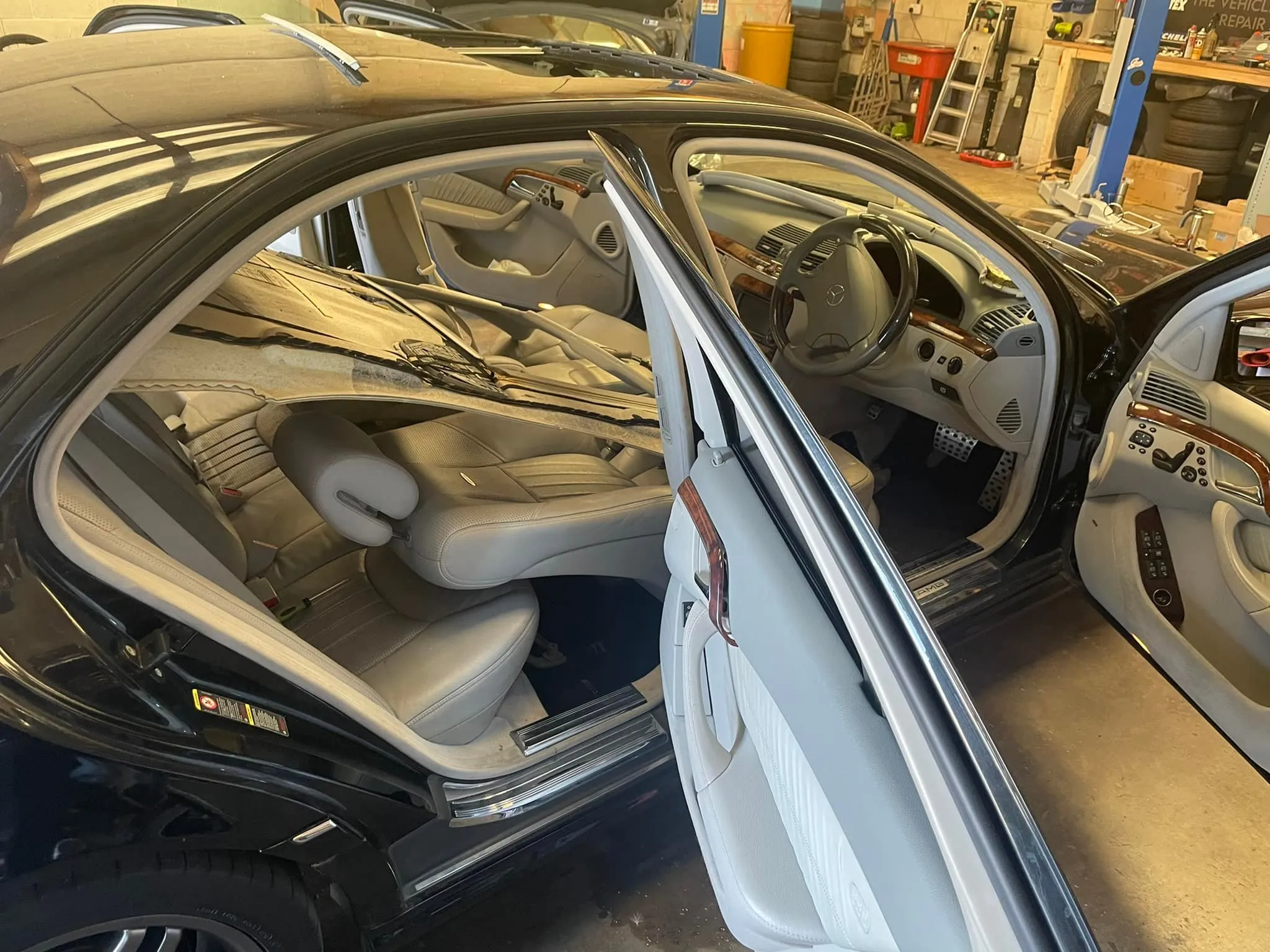 The inside of a car with its door open.